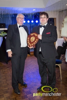 Roger presents Adam with the bandsperson of the year trophy